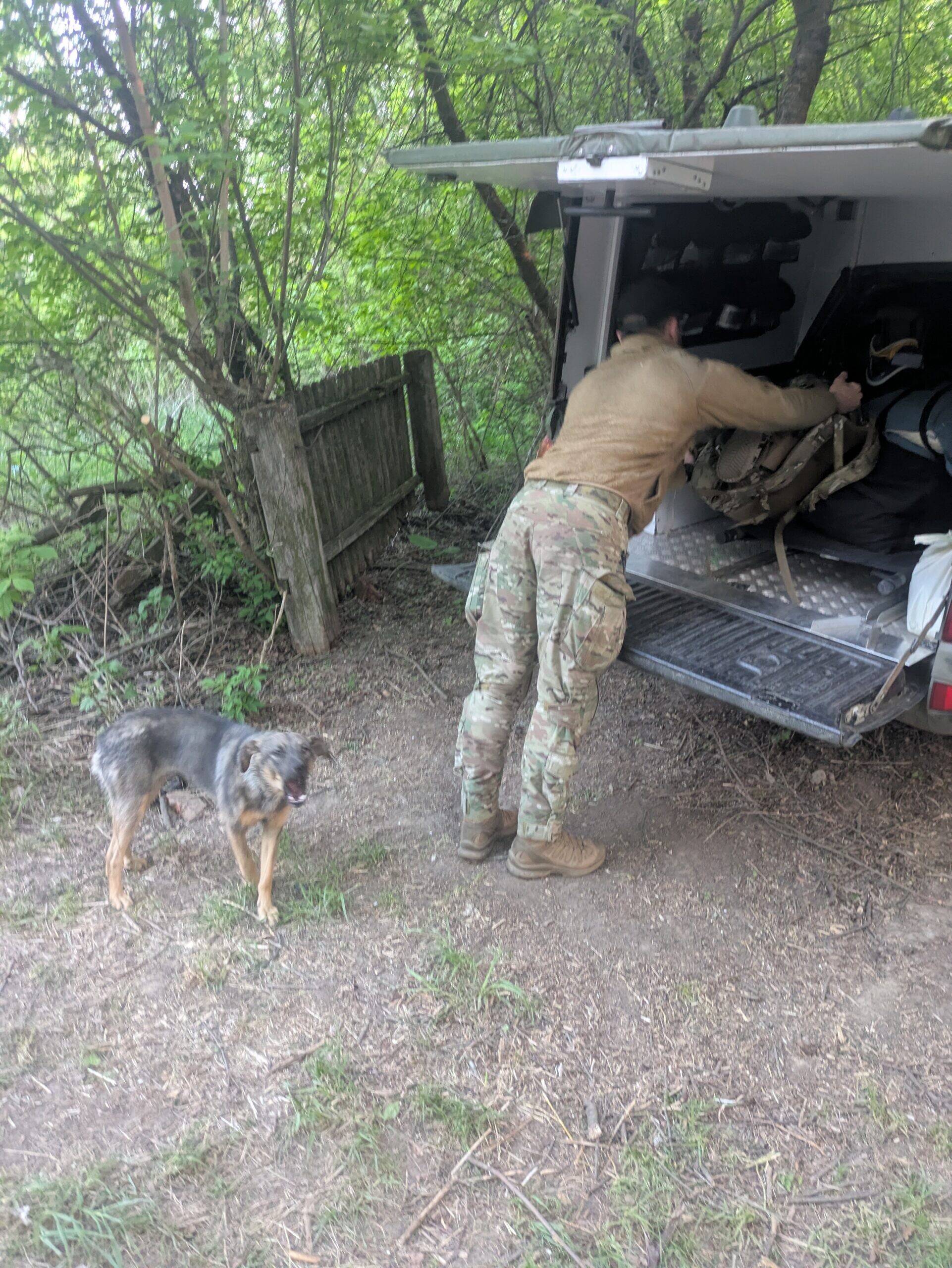 andrew loading car with discontent woofer